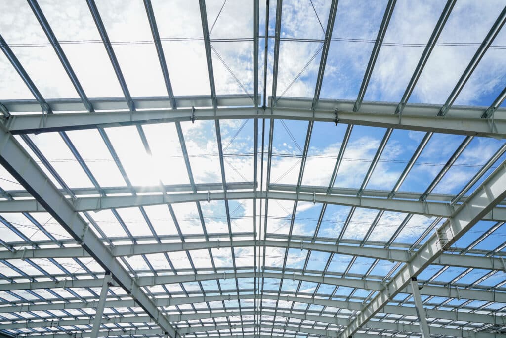 a steel roof in front of a cloudy sky